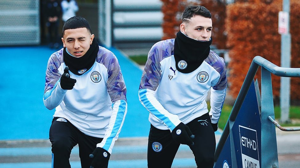 YOUNG GUNS : Ian Carlo Poveda and Phil Foden stride out ahead of Thursday's training session