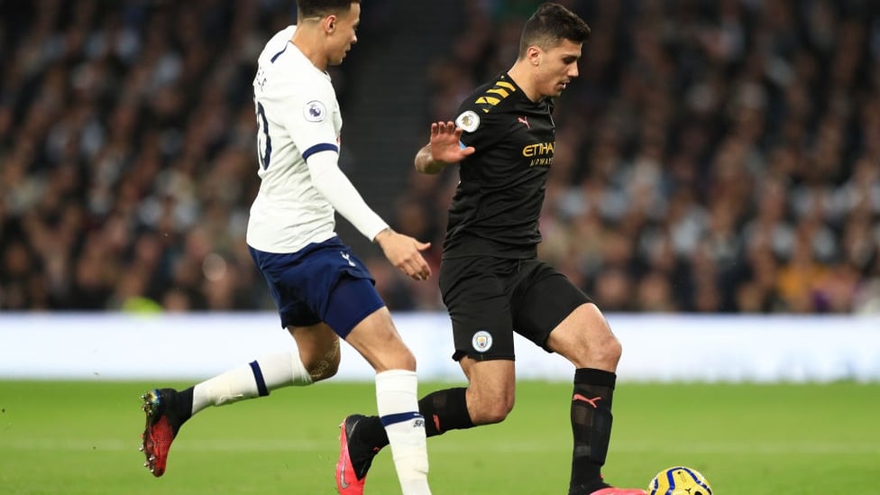 HANDS OFF : Rodri holds of Alli in a tense midfield battle.