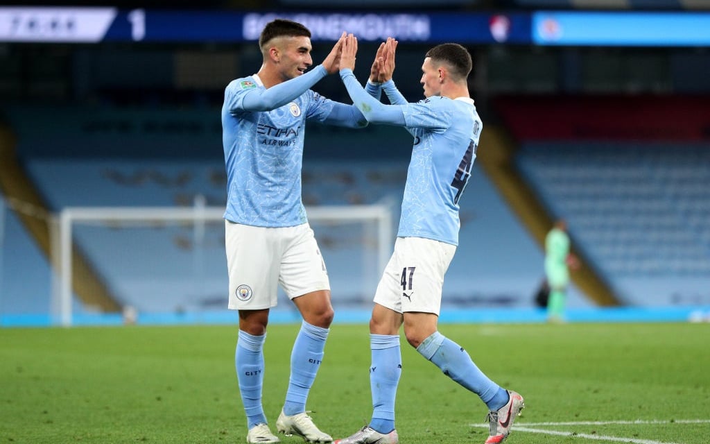 Ferran Torres congratulates goal-scorer Phil Foden