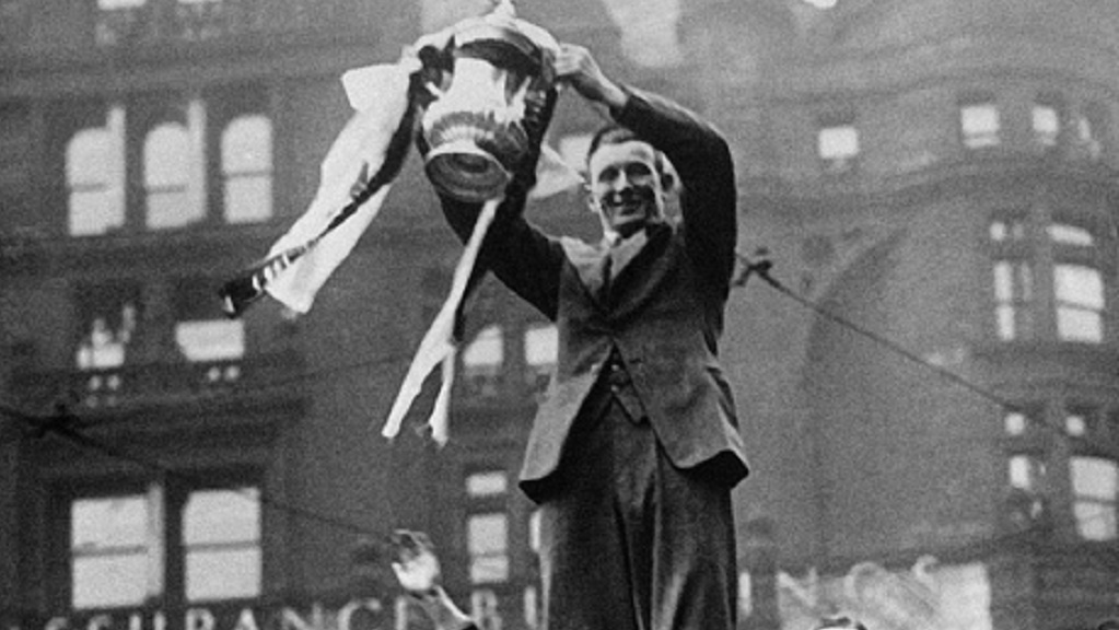 SAM COWAN : With the FA Cup on  top of a bus in the Manchester city centre