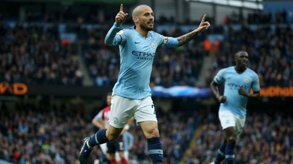 SOLID SILVA : David Silva wheels away in celebration after his superb strike put us 3-0 up