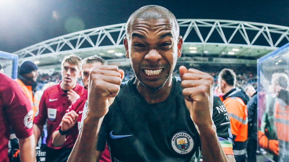 THAT WINNING FEELING : Fernandinho can't contain his joy after our hard-fought win away at Huddersfield in 2017