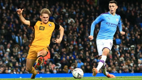 FOUR TOPS: Phil Foden is on target to register City's fourth goal of the evening