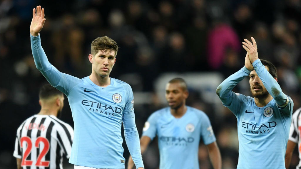 TOUGH NIGHT : A disappointed John Stones and David Silva salute the travelling City fans after the full time whistle