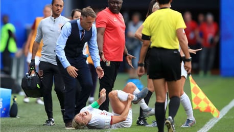 WORRY: Concerned England boss Phil Neville rushes over to Steph Houghton after the injury to the Lionesses skipper