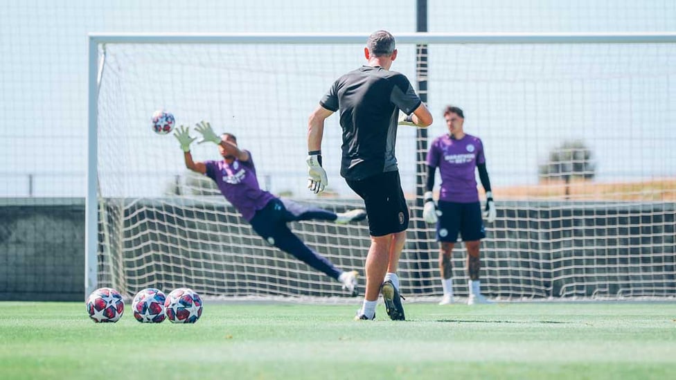  : Wright stuff: Keeper coach Richard Wright tests Ederson's reflexes