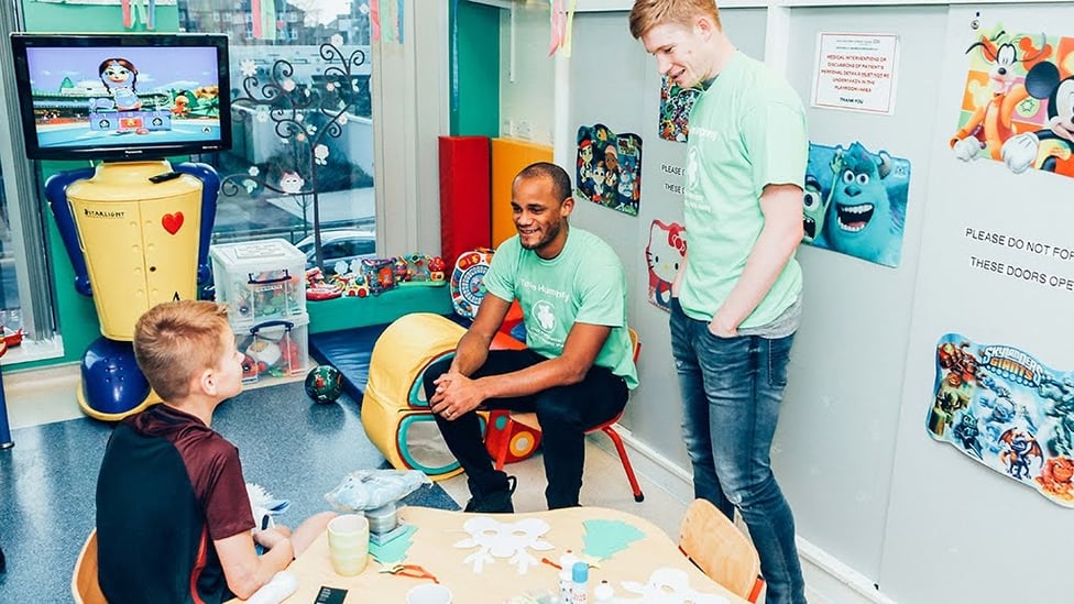 HOSPITAL VISIT : Kompany and KDB visit a fan.