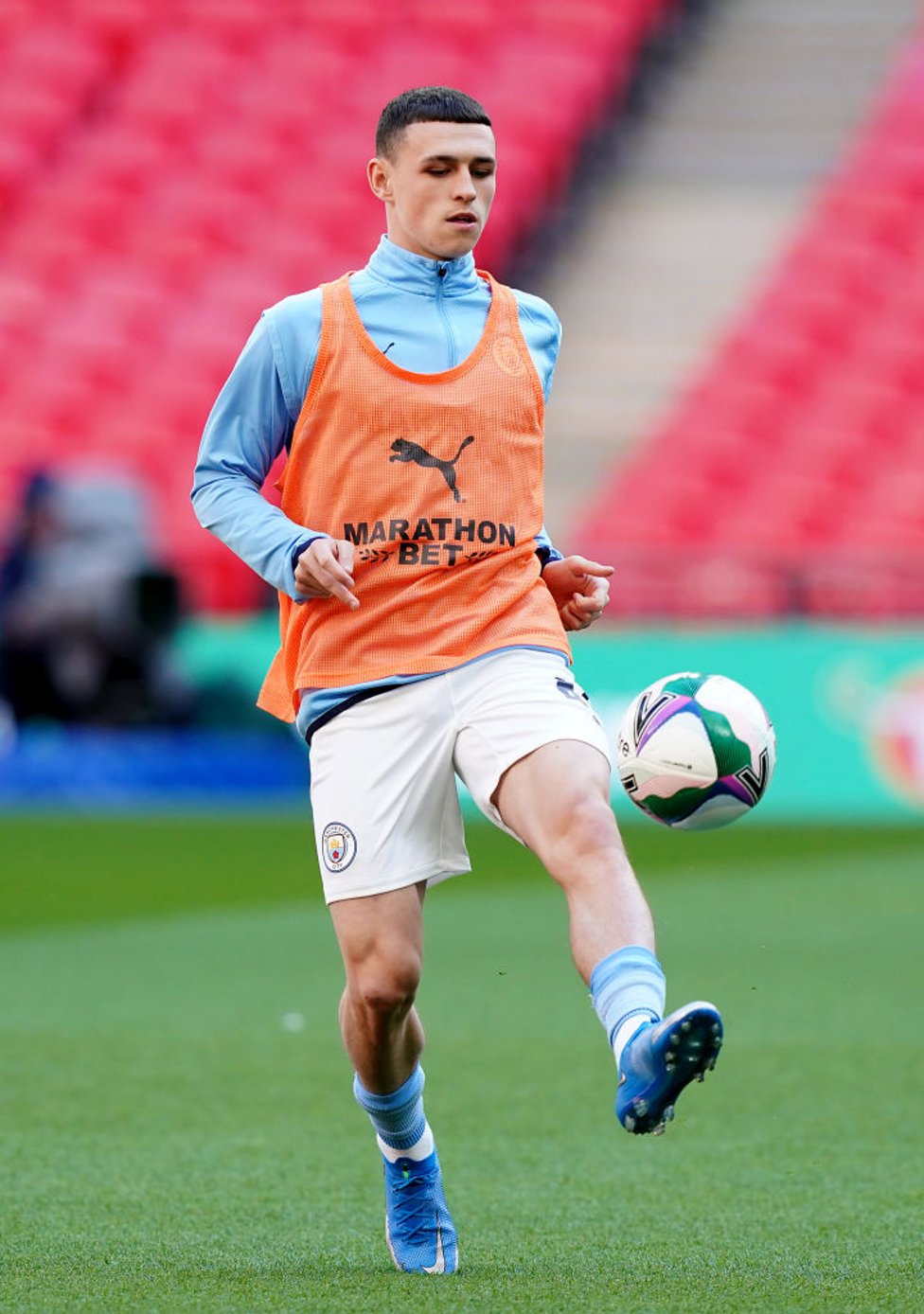 GAME FACE : Foden looks fully focused as he gets a feel of the ball pre-match.