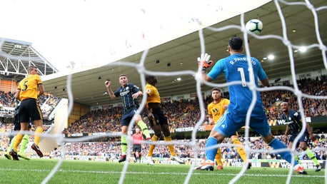 HEAD BOY: Aymeric Laporte beats the Wolves defence to arrow home City's equaliser
