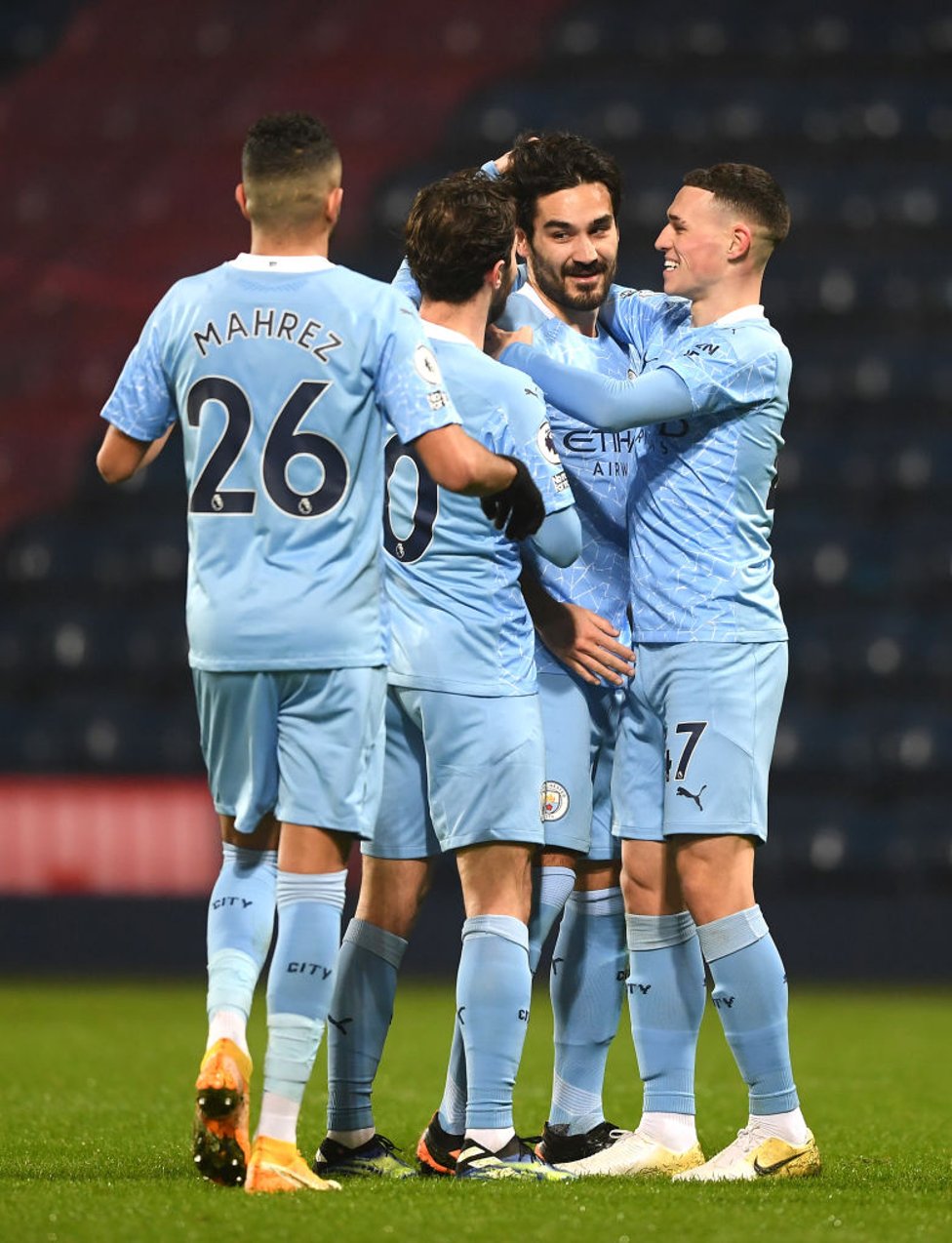 DOUBLE TROUBLE : Gundogan celebrates after stroking in our third and his second of the evening on the half-hour mark.