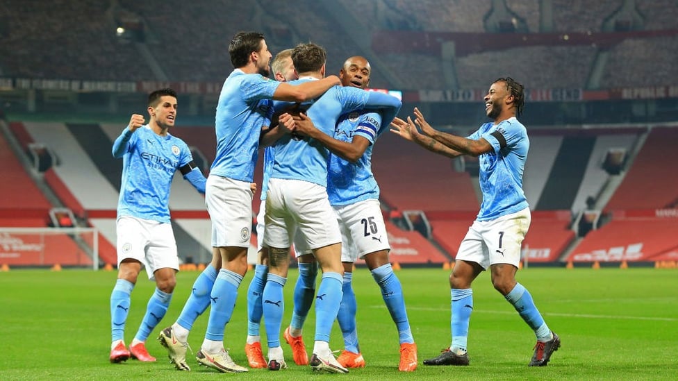 SQUAD GOALS: The lads celebrate with Stones