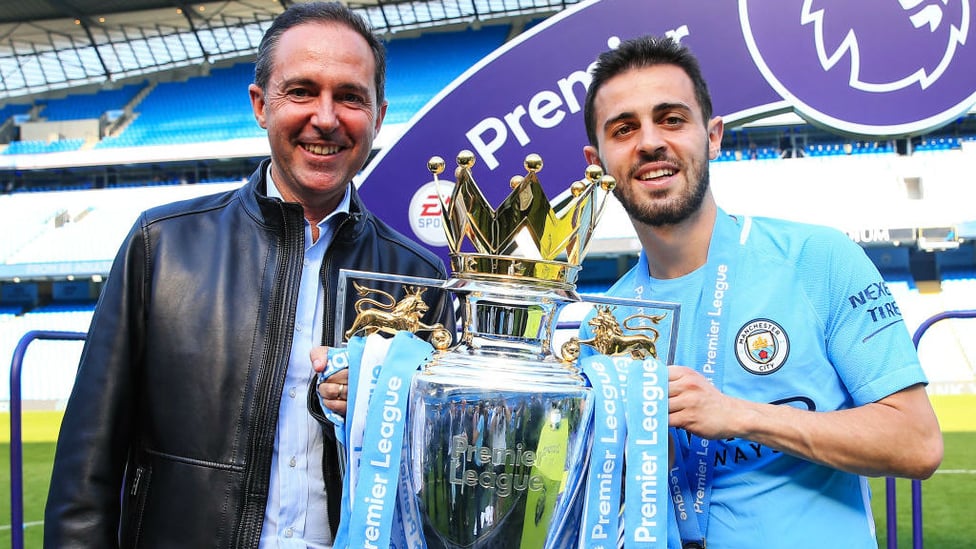 FAMILY AFFAIR : Bernardo and his proud father pose with the Premier League trophy after City's record-breaking 2017/18 title success