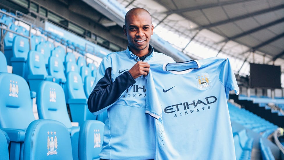 TRUE BLUE : Ferna is all smiles after sealing his move to City from Shakhtar Donetsk in the summer of 2013