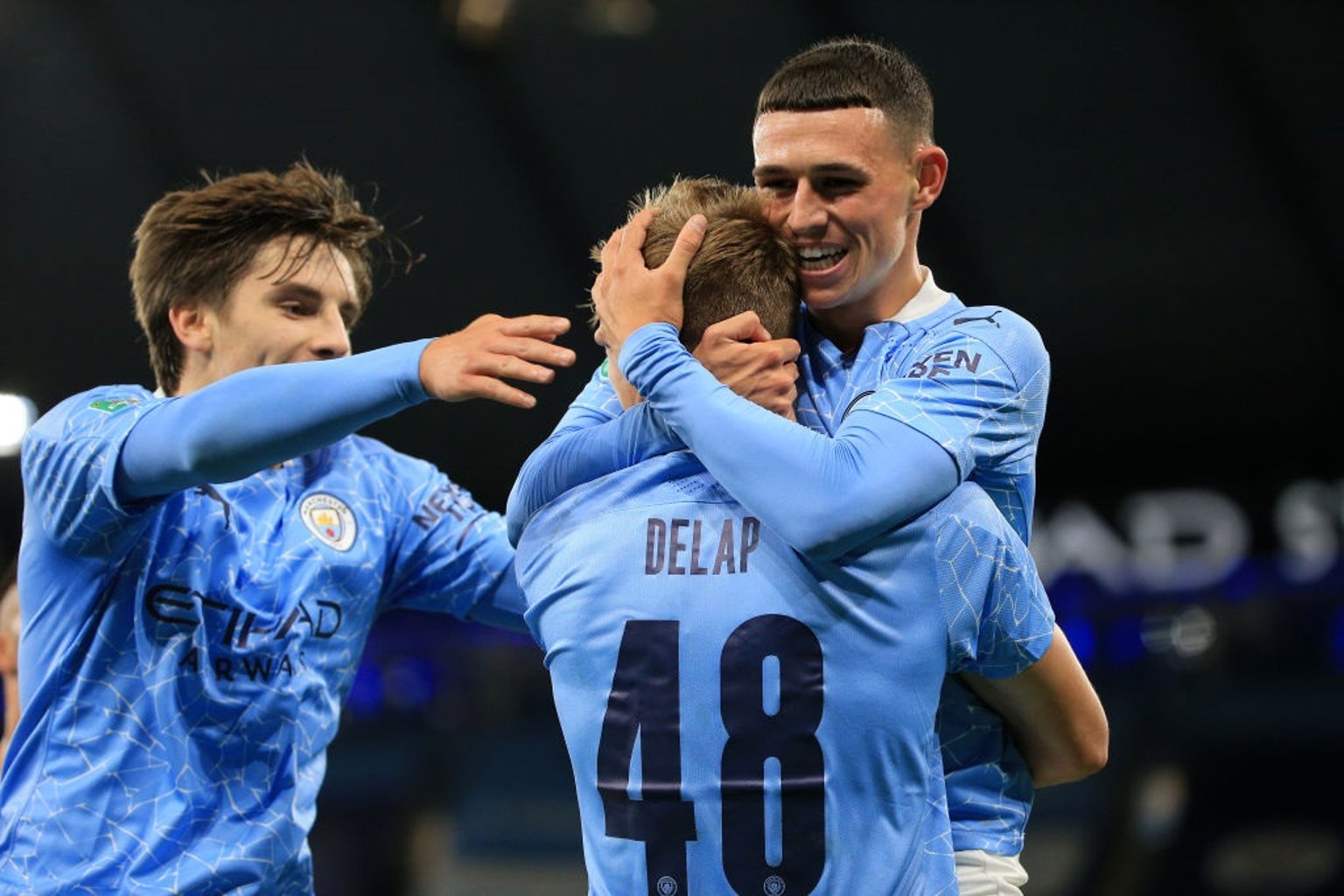 Phil Foden and Adrian Bernabe congratulate Delap