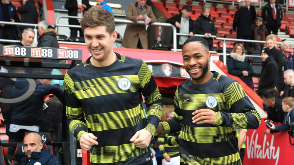 ALL SMILES : A fit-again John Stones and Raheem Sterling step out for City's pre-match warm-up