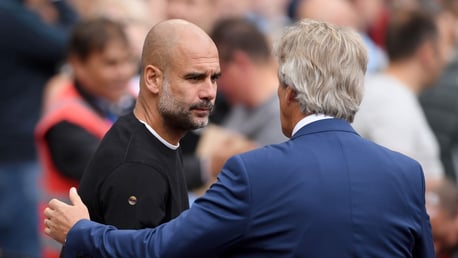 PAST AND PRESENT: Pep Guardiola and Manuel Pellegrini shake hands on the touchline.