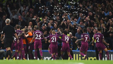 PAPER CHASE: The City players celebrate in front of the travelling fans