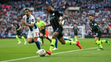 RAZZLE DAZZLE: Raheem Sterling takes on the Brighton defence