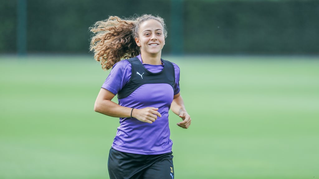 ALL SMILES: The Portuguese midfielder looks delighted at getting into the swing of things at City