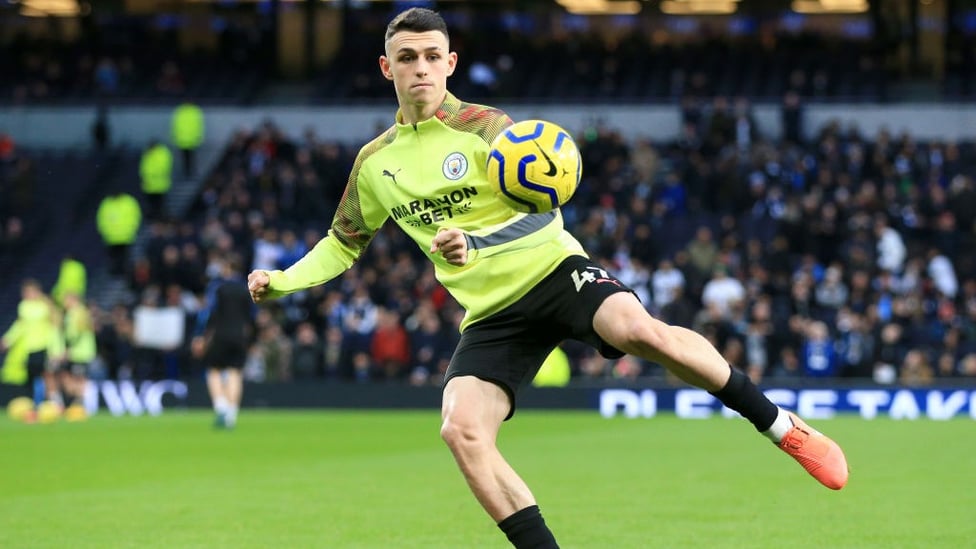 EYES ON THE PRIZE : Foden lines up a pass during the warm up.