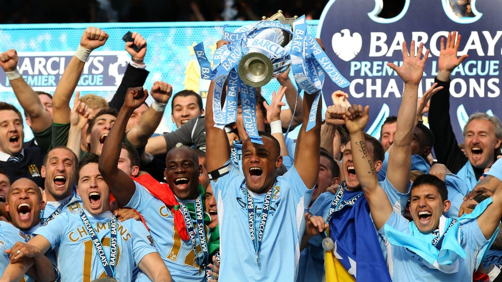 ECSTASY : The Belgian lifts the Premier League trophy aloft in 2012