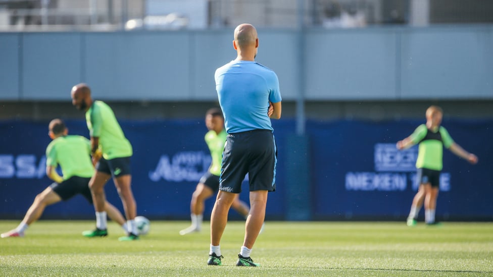 STANDING GUARD-IOLA : Pep Guardiola surveys the action