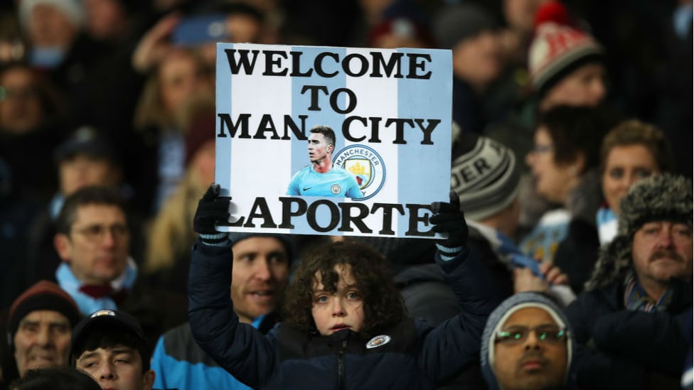 FAN-TASTIC : The Blues faithful display a welcome sign to our new arrival before Aymeric's debut