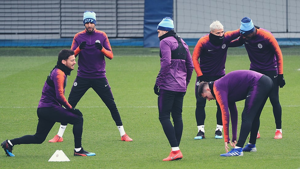 STRETCH OUT AND WAIT : David Silva limbers up in front of the watching media