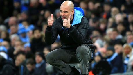 THUMBS UP: Guardiola signals his approval from the touchline.