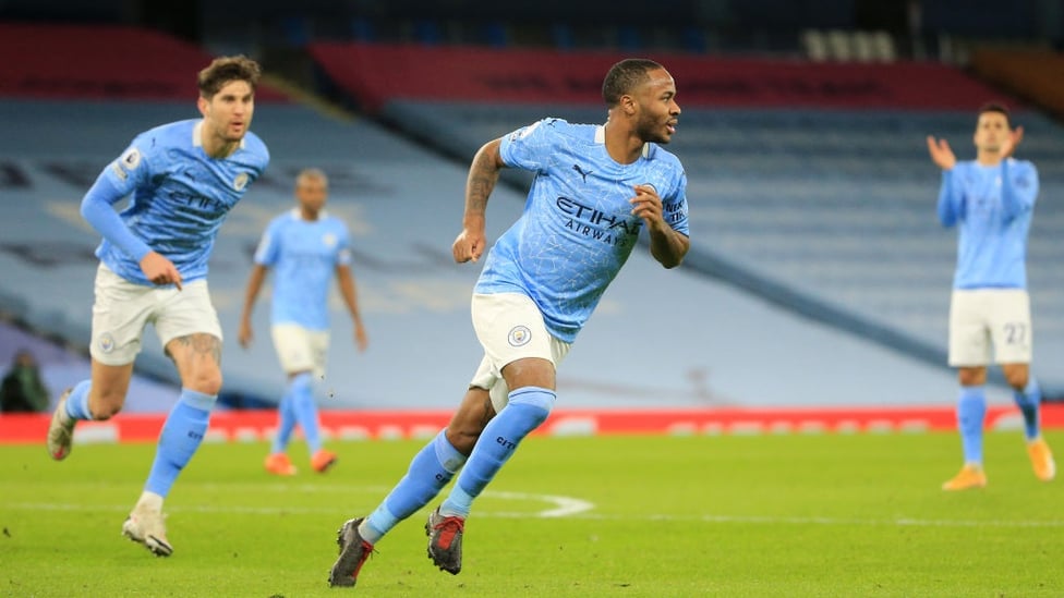 STERLING WORK : Raheem wheels off to celebrate making it 4-0, firing a superb free-kick into the top corner.