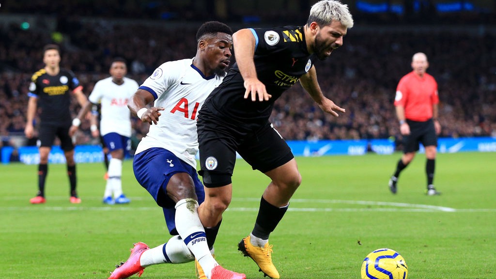 SHRIEK: Aguero tumbles after Aurier's challenge inside the box.