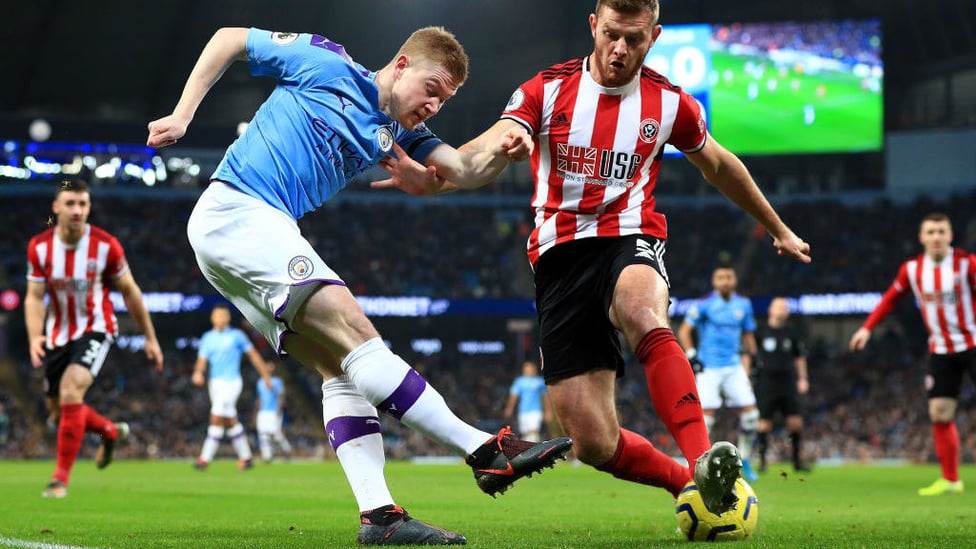 SUPPLY LINE : Kevin De Bruyne looks to sneak a cross past Jack O'Connell