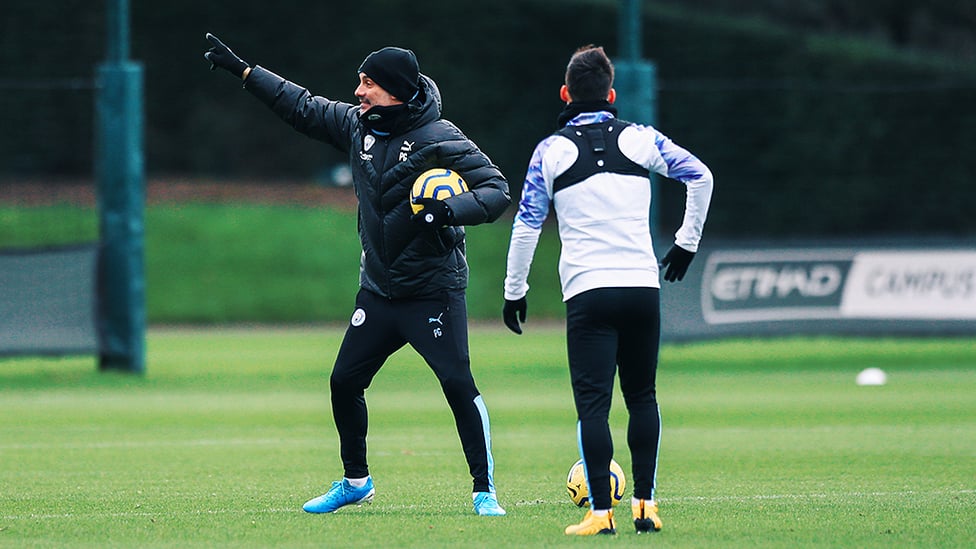 INSTRUCTING : Pep gets his point across to David Silva.