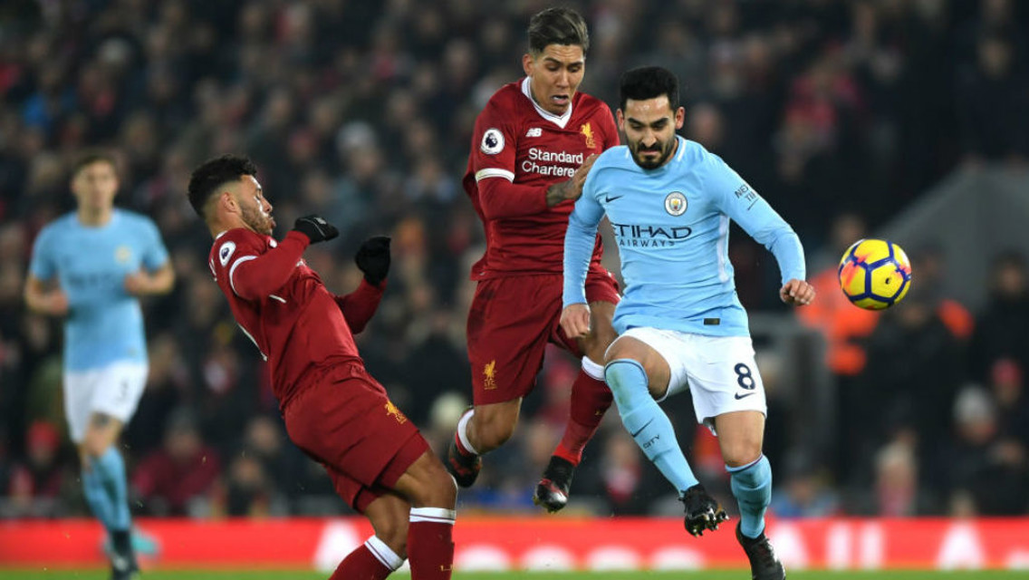 ACTION STATIONS: Ilkay Gundogan in the thick of the action at Anfield