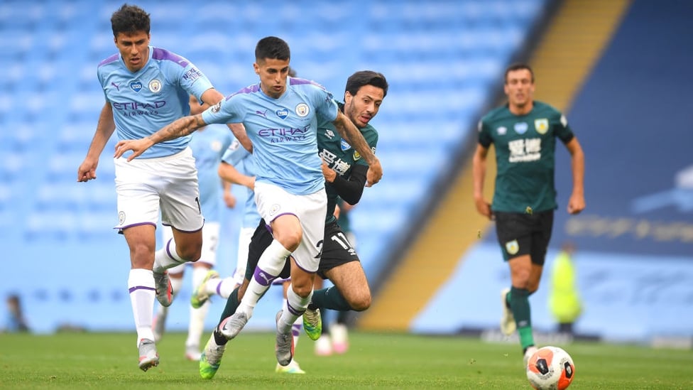 BATTLE : Cancelo battles with McNeil as the pair race for the ball early on.