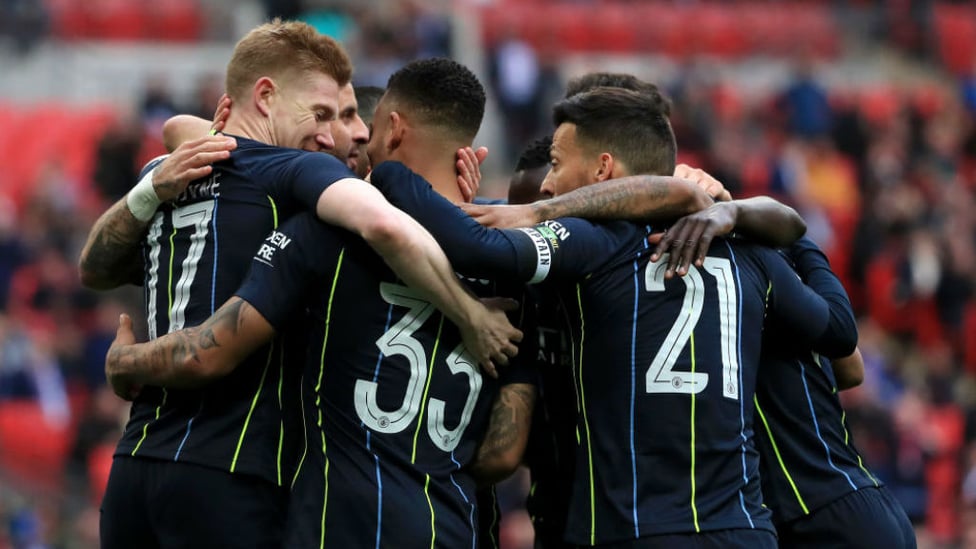 CELEBRATION TIME : Gabriel Jesus is joined by his happy team-mates after his opening goal