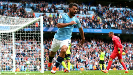 AT THE DOUBLE: Sergio Aguero wheels away, having bagged the rebound after Ben Hamer spilled Benjamin Mendy's cross