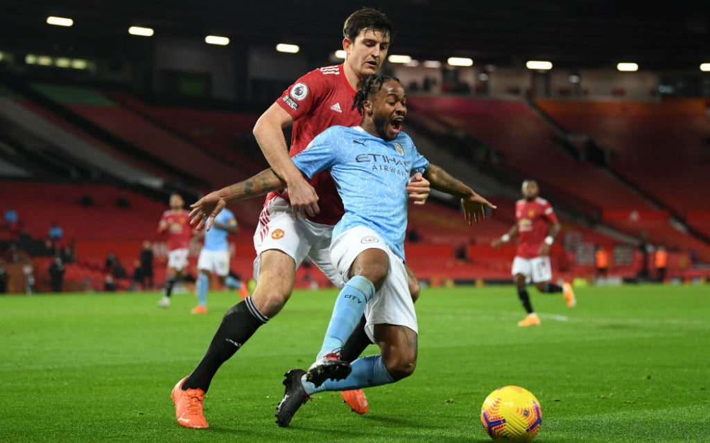 NO ENTRY: Harry Maguire gets a grip on Raheem Sterling