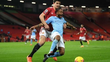 NO ENTRY: Harry Maguire gets a grip on Raheem Sterling