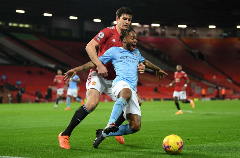 NO ENTRY: Harry Maguire gets a grip on Raheem Sterling