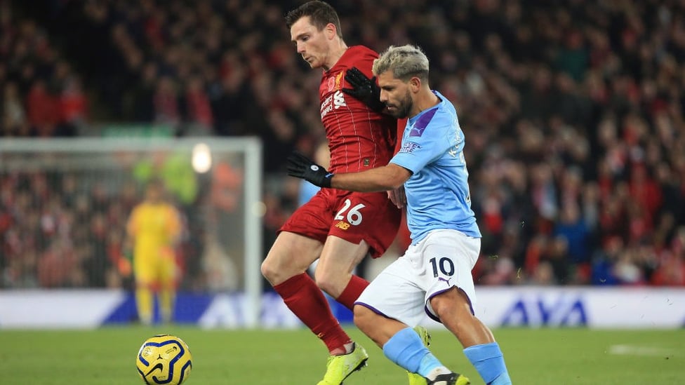 PRESSURE : Sergio Aguero tries to get City back in the game following Mohamed Salah's goal to put the hosts two up.