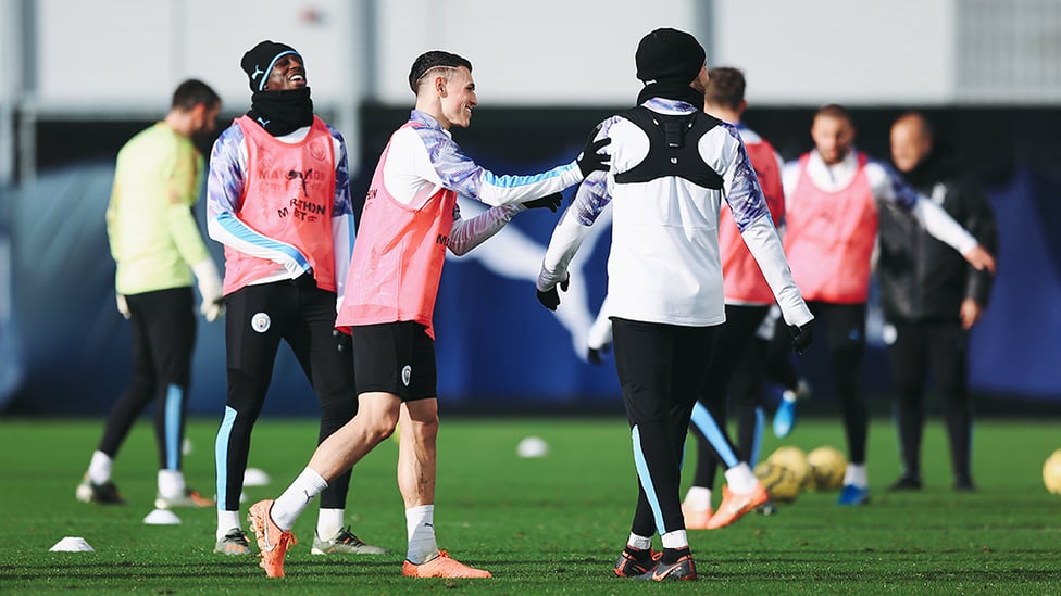 PHIL-ANTHROPY : Phil Foden shares a joke with his teammates