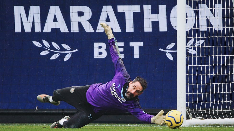 AT FULL STRETCH : Scott Carson dives to keep out a low shot