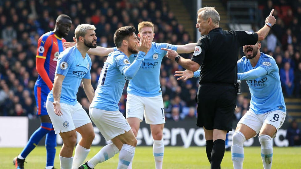 APPEAL : City players appeal for a free-kick on the edge of the box but are dismissed by referee Martin Atkinson.