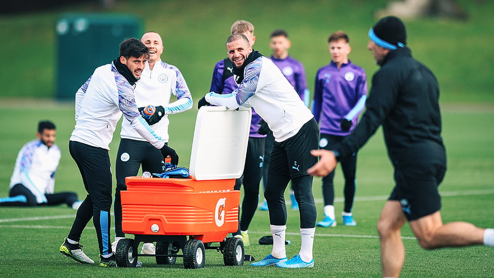 SMILES BETTER : David Silva, Angelino and Kyle Walker take a well deserved breather