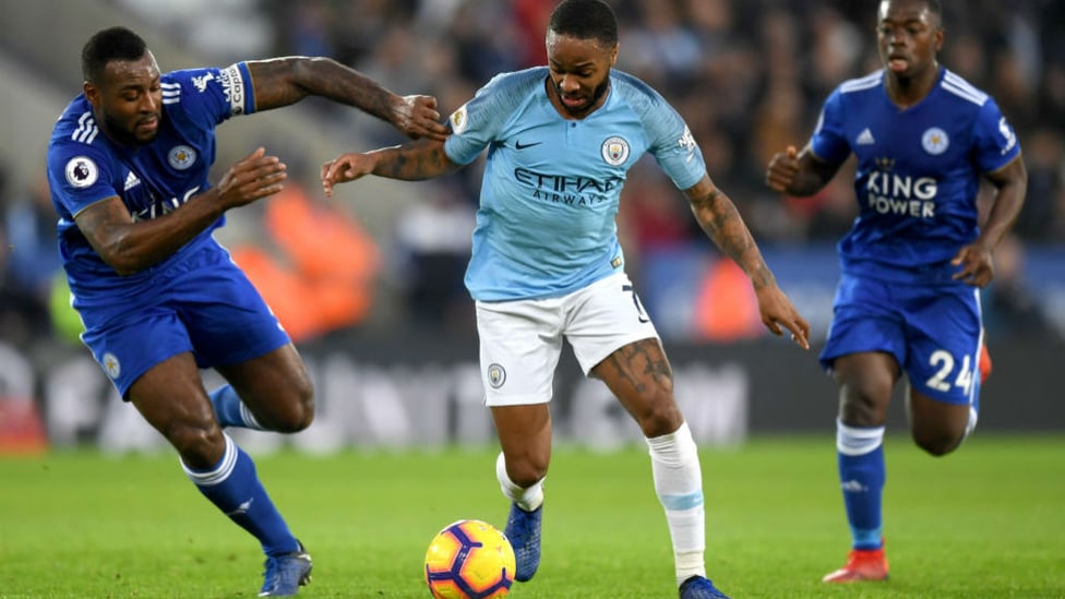 CENTRE OF ATTENTION : Raheem Sterling takes on Wes Morgan