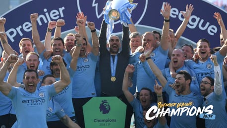 CHAMPIONS: Pep Guardiola lifts the trophy aloft.