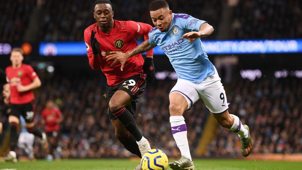 HARD AT IT: Gabriel Jesus tries to free himself of Aaron Wan-Bissaka's attentions.