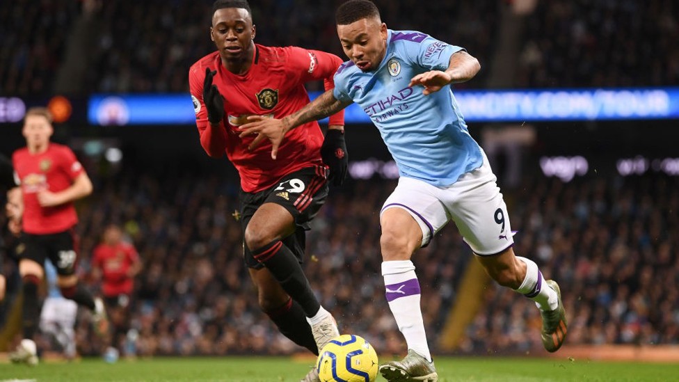 HARD AT IT : Gabriel Jesus tries to free himself of Aaron Wan-Bissaka's attentions.