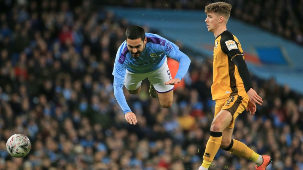 FLYING HIGH : Ilkay Gundogan takes a tumble as the FA Cup action hots up